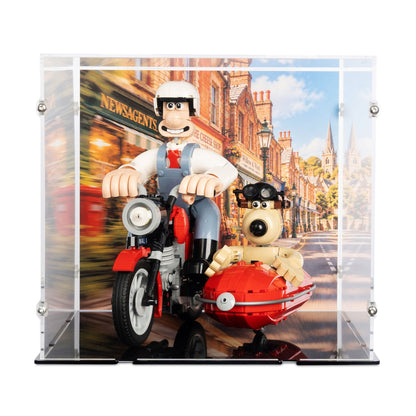 Acrylic display case for lego 21371 with a printed backdrop showing a cartoon motorcycle scene, containing two small toy figures posed on the motorcycle and sidecar.