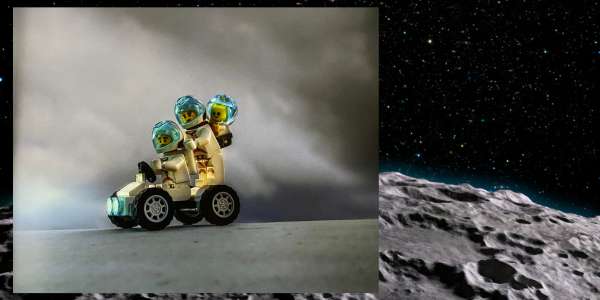 a picture of toy photography of a LEGO astronaut family in a space buggy