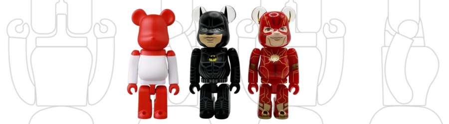 three bearbrick figures, austrian flag, batman, the flash