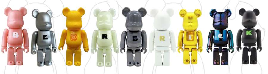 picture of Bearbrick figures with letters on their torsos