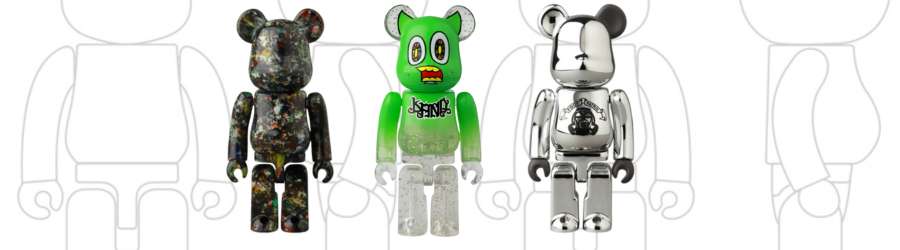 three bearbrick figures footpatrol, jackson pollock and land