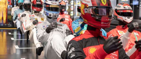 image of mannequin race car drivers in seated positions