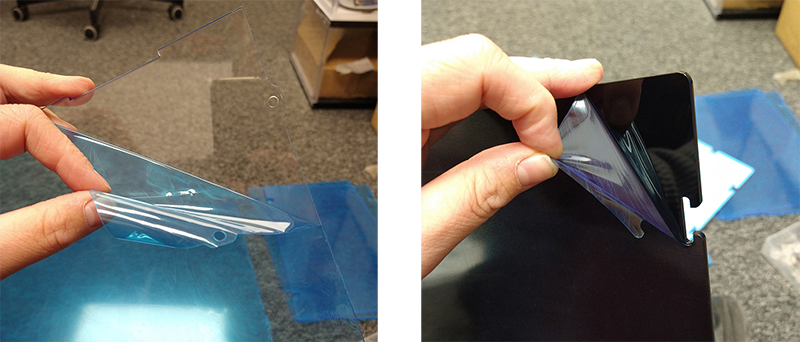 Peeling protective film off acrylic panel